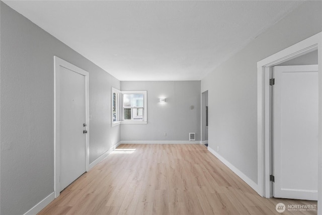 10704 5th Ave S, Tacoma, WA 98444 - interior space featuring visible vents, light wood-style flooring, and baseboards
