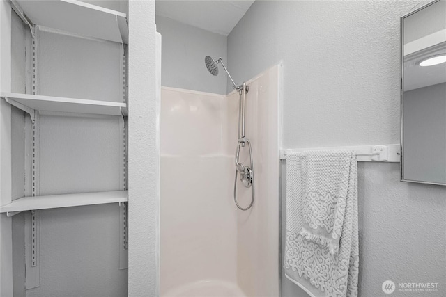 10704 5th Ave S, Tacoma, WA 98444 - full bathroom featuring a textured wall and walk in shower