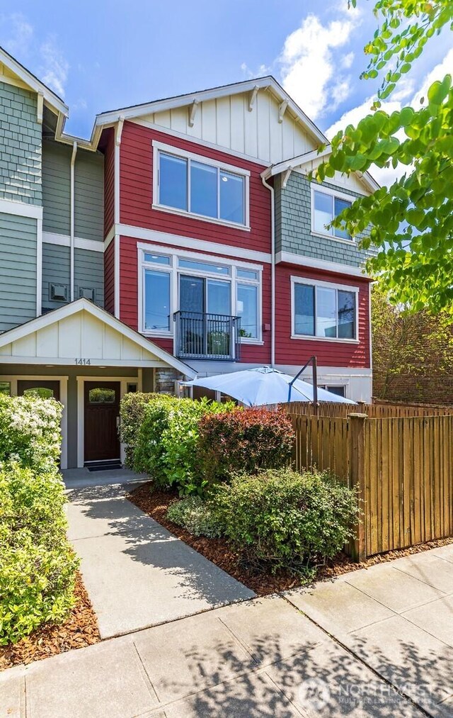 multi unit property with fence and board and batten siding