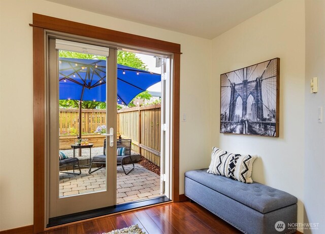doorway to outside featuring wood finished floors