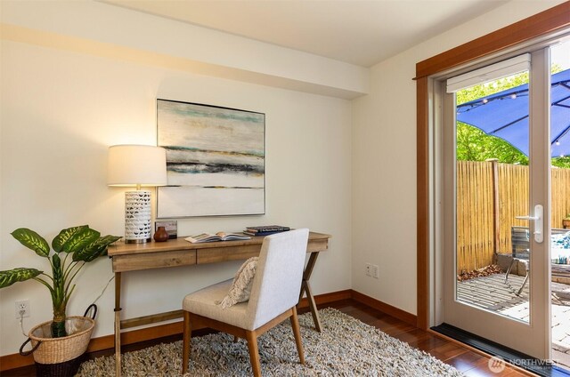 office featuring baseboards and wood finished floors