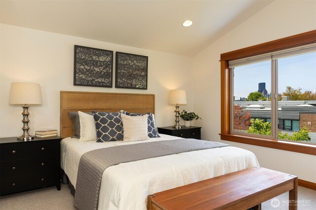 bedroom featuring recessed lighting, vaulted ceiling, and light carpet