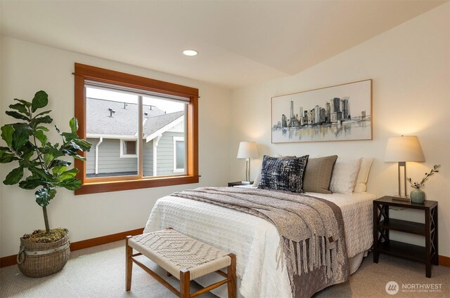 carpeted bedroom featuring baseboards and recessed lighting