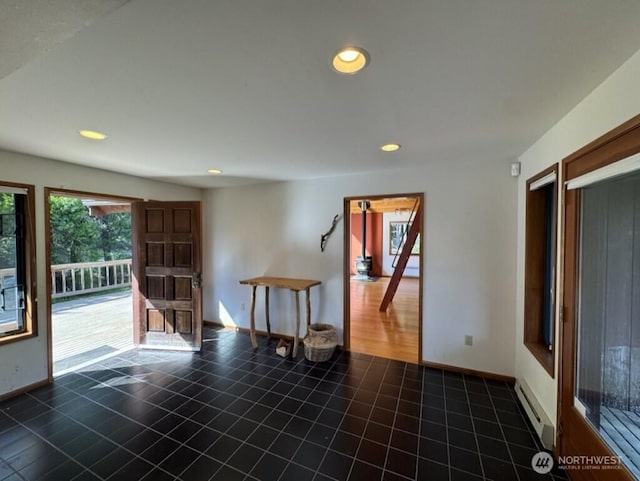 1052 Vusario Ln, Orcas Island, WA 98245 - unfurnished room with baseboards, recessed lighting, a baseboard radiator, and tile patterned flooring