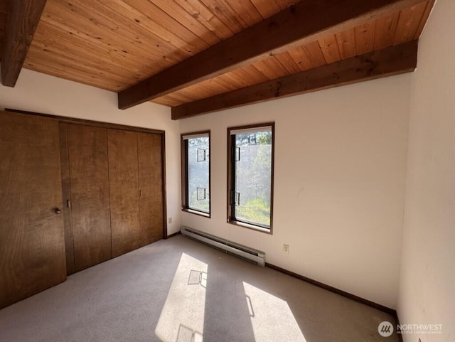 1052 Vusario Ln, Orcas Island, WA 98245 - unfurnished bedroom featuring a closet, a baseboard heating unit, wooden ceiling, carpet flooring, and beamed ceiling