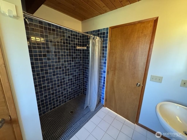 1052 Vusario Ln, Orcas Island, WA 98245 - full bath featuring wood ceiling, tiled shower, tile patterned floors, and a sink