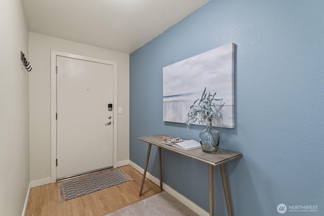 700 Front St S Unit A304, Issaquah, WA 98027 - doorway to outside with baseboards and wood finished floors