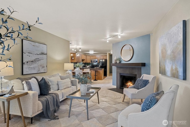 700 Front St S Unit A304, Issaquah, WA 98027 - living area featuring rail lighting and a tile fireplace