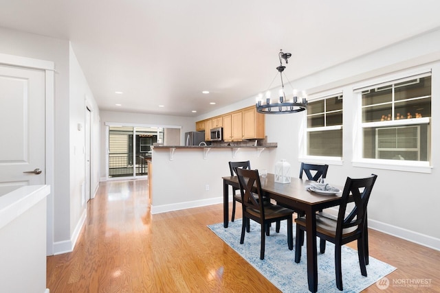 2608 SW Myrtle St, Seattle, WA 98106 - dining room with a chandelier, light wood finished floors, baseboards, and recessed lighting