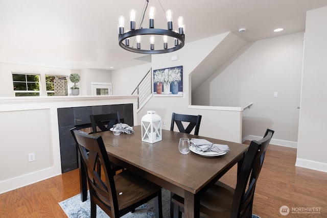 2608 SW Myrtle St, Seattle, WA 98106 - dining room with wood finished floors, a chandelier, baseboards, and recessed lighting