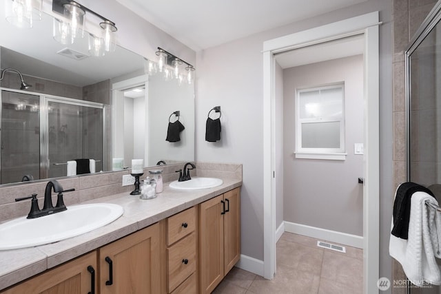 2608 SW Myrtle St, Seattle, WA 98106 - full bath featuring double vanity, a stall shower, tile patterned flooring, and baseboards