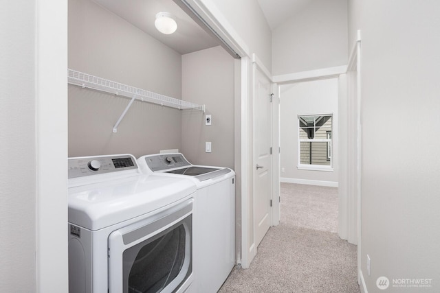 2608 SW Myrtle St, Seattle, WA 98106 - laundry area with separate washer and dryer, light carpet, and baseboards