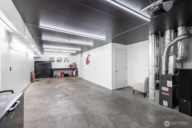 2608 SW Myrtle St, Seattle, WA 98106 - garage featuring heating unit and a garage door opener