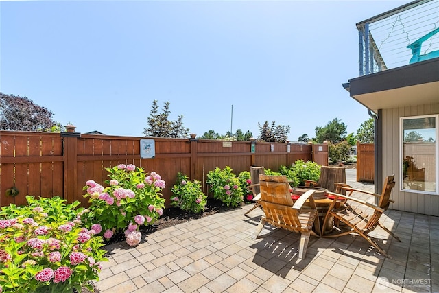 view of patio / terrace featuring fence