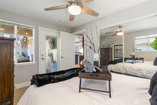 bedroom featuring carpet floors, baseboards, and a ceiling fan