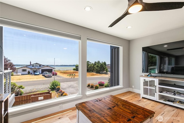 interior space with light wood-style floors, a ceiling fan, and recessed lighting
