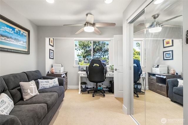 office with carpet and a ceiling fan