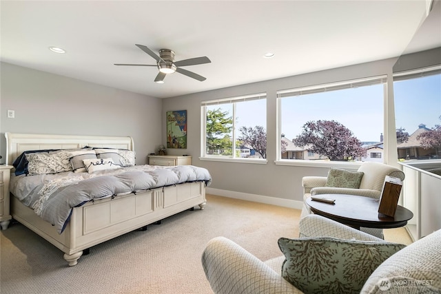 bedroom with recessed lighting, baseboards, light carpet, and a ceiling fan
