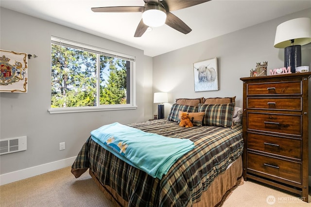 bedroom with light colored carpet, baseboards, ceiling fan, and visible vents