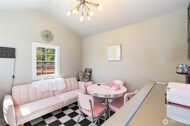 living area with tile patterned floors, a notable chandelier, and lofted ceiling