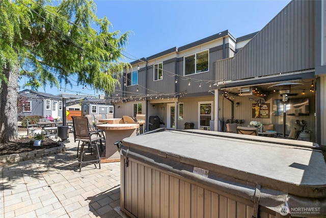 exterior space with a balcony and outdoor dry bar