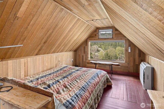 bedroom featuring heating unit, wood ceiling, wood walls, and lofted ceiling