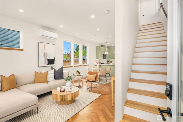 living room featuring recessed lighting, a wall mounted air conditioner, baseboards, and stairway