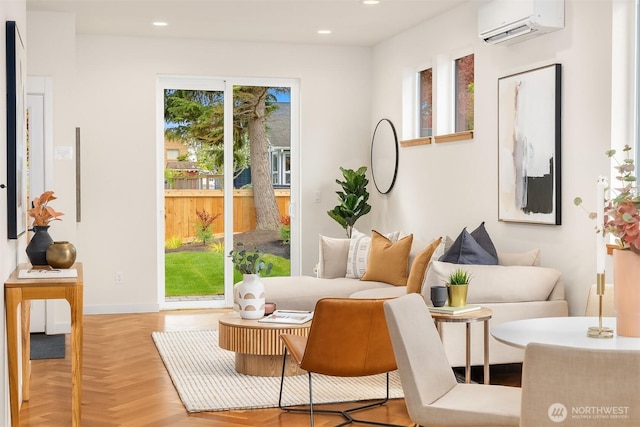 sitting room with recessed lighting, baseboards, and a wall mounted AC