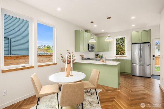 dining space with baseboards and recessed lighting