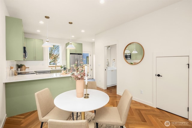 dining area featuring recessed lighting and baseboards