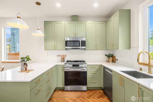 kitchen with green cabinets and stainless steel appliances