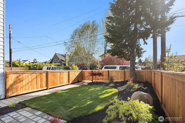 view of yard with a fenced backyard
