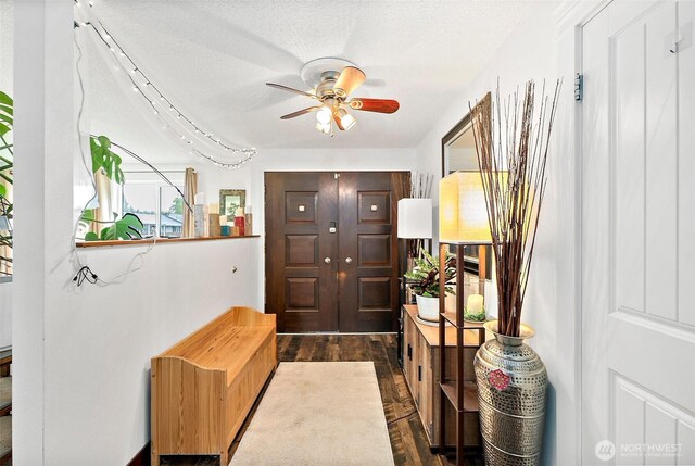 entrance foyer featuring dark wood-style flooring and a ceiling fan