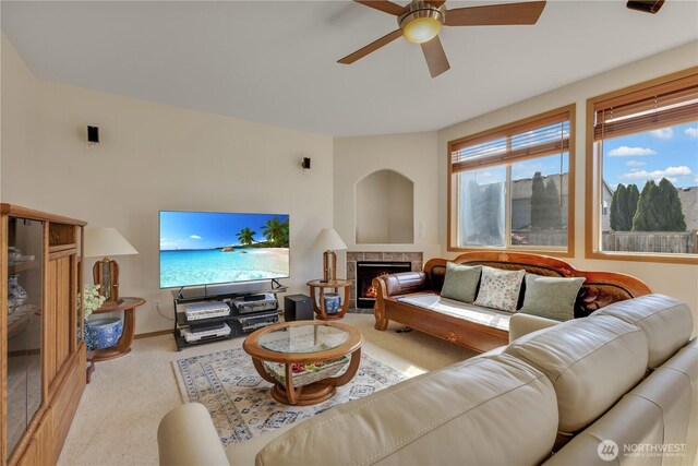 17422 90th Ave E, Puyallup, WA 98375 - carpeted living room with a ceiling fan, a lit fireplace, and baseboards