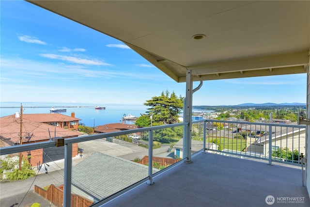 balcony featuring a water view