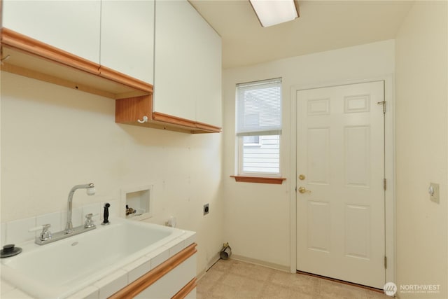 laundry area featuring cabinet space, washer hookup, and electric dryer hookup