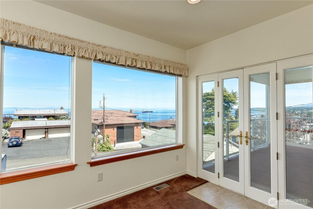 sunroom featuring french doors and plenty of natural light