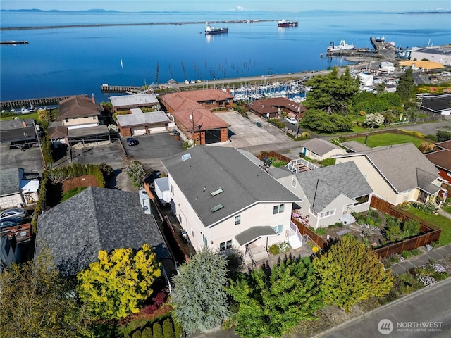 aerial perspective of suburban area with a large body of water