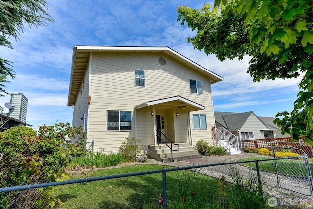 view of front of home featuring a fenced backyard