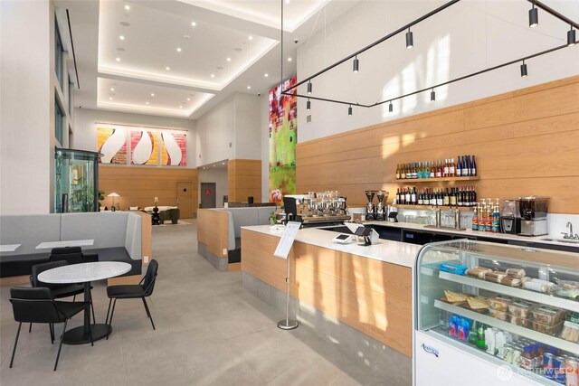 reception featuring a sink and a community bar
