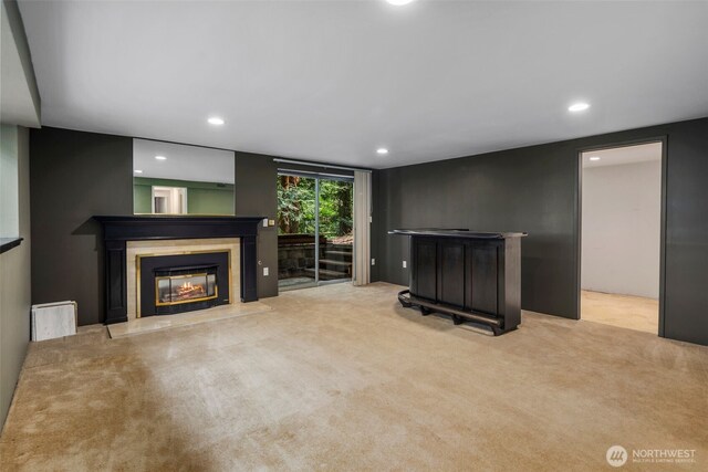 540 SW Fernwood St, Issaquah, WA 98027 - unfurnished living room featuring carpet flooring, a glass covered fireplace, recessed lighting, and a bar