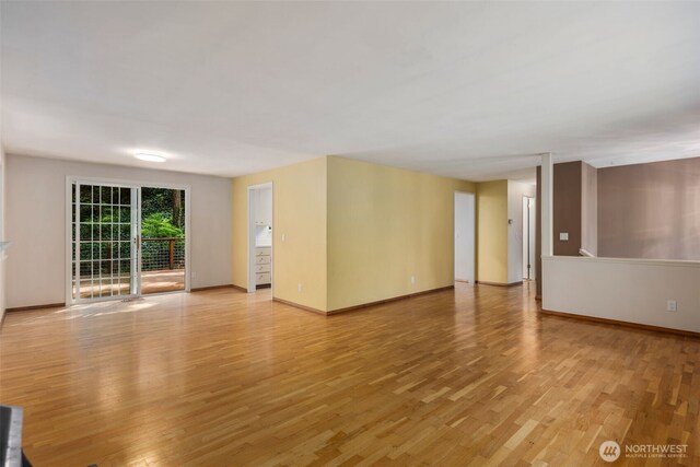 540 SW Fernwood St, Issaquah, WA 98027 - unfurnished living room with light wood-type flooring and baseboards