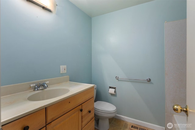 540 SW Fernwood St, Issaquah, WA 98027 - bathroom with toilet, vanity, tile patterned flooring, and baseboards