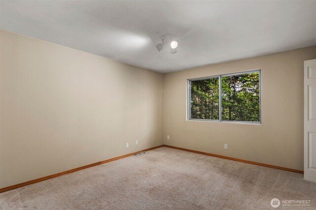 540 SW Fernwood St, Issaquah, WA 98027 - spare room with carpet floors and baseboards