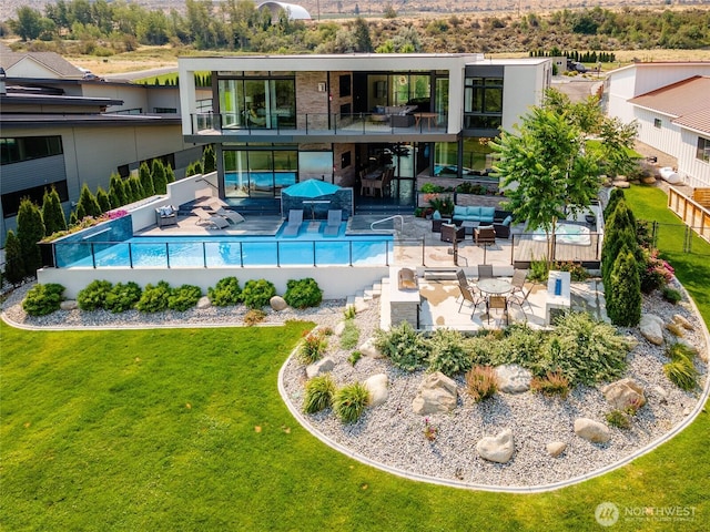 64 Orchard Pl, Orondo, WA 98843 - view of swimming pool with a yard, fence, an outdoor living space, and a patio area