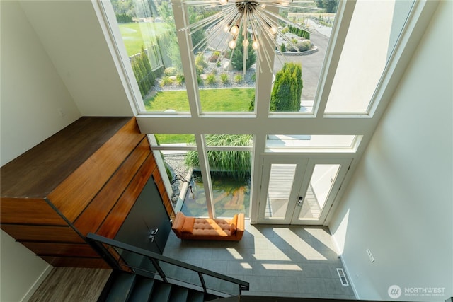 64 Orchard Pl, Orondo, WA 98843 - sunroom / solarium featuring a notable chandelier, french doors, and visible vents