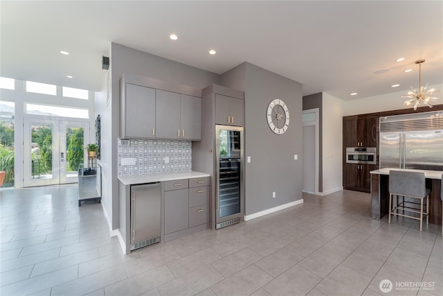 64 Orchard Pl, Orondo, WA 98843 - kitchen featuring wine cooler, light countertops, and gray cabinets