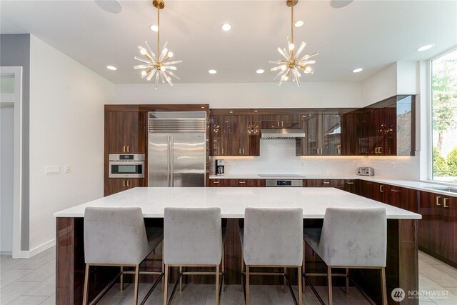 64 Orchard Pl, Orondo, WA 98843 - kitchen featuring an inviting chandelier, modern cabinets, and stainless steel appliances