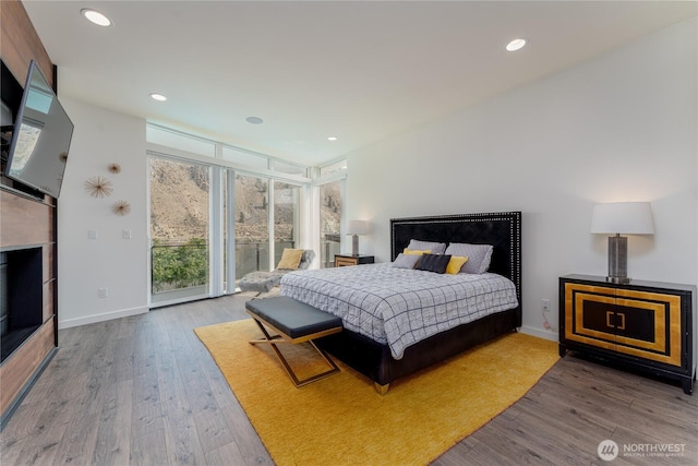 64 Orchard Pl, Orondo, WA 98843 - bedroom with access to outside, baseboards, and wood finished floors