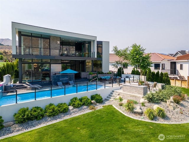 64 Orchard Pl, Orondo, WA 98843 - view of pool featuring a lawn, a fenced in pool, an outdoor hangout area, and a patio area